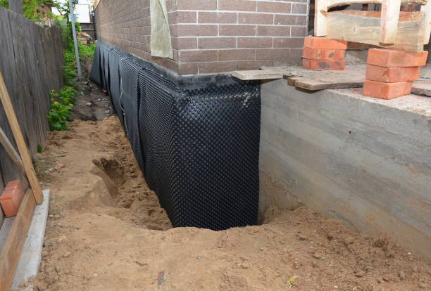 Happy homeowners after waterproofing job in Delong